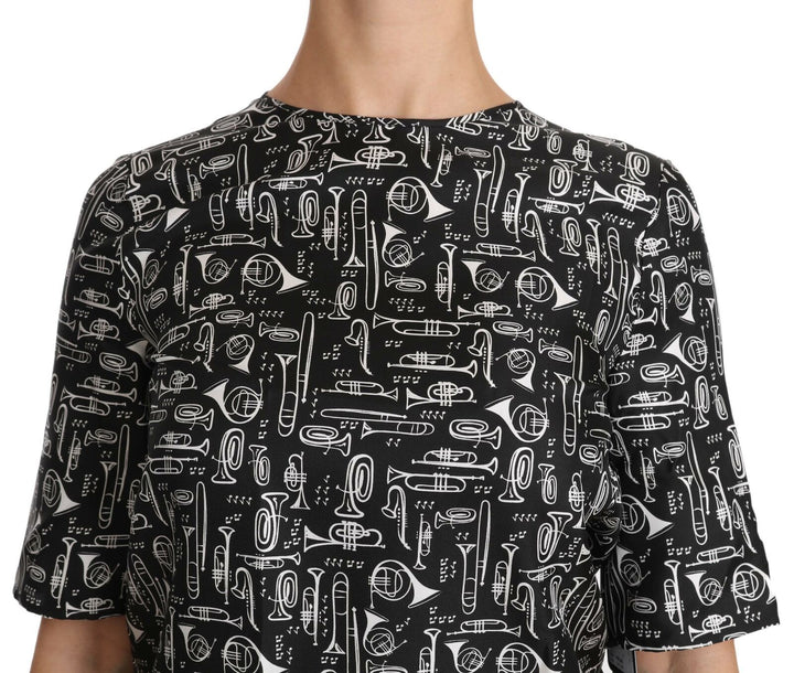 Schwarze Seidenbluse mit Musikinstrumenten-Druck