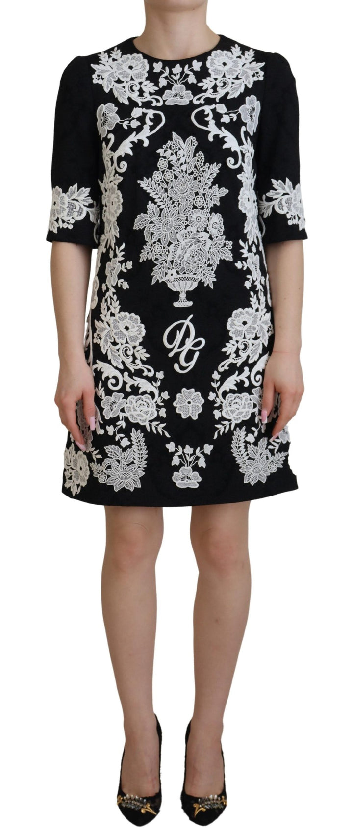 Elegant black A-line mini dress with lace trim
