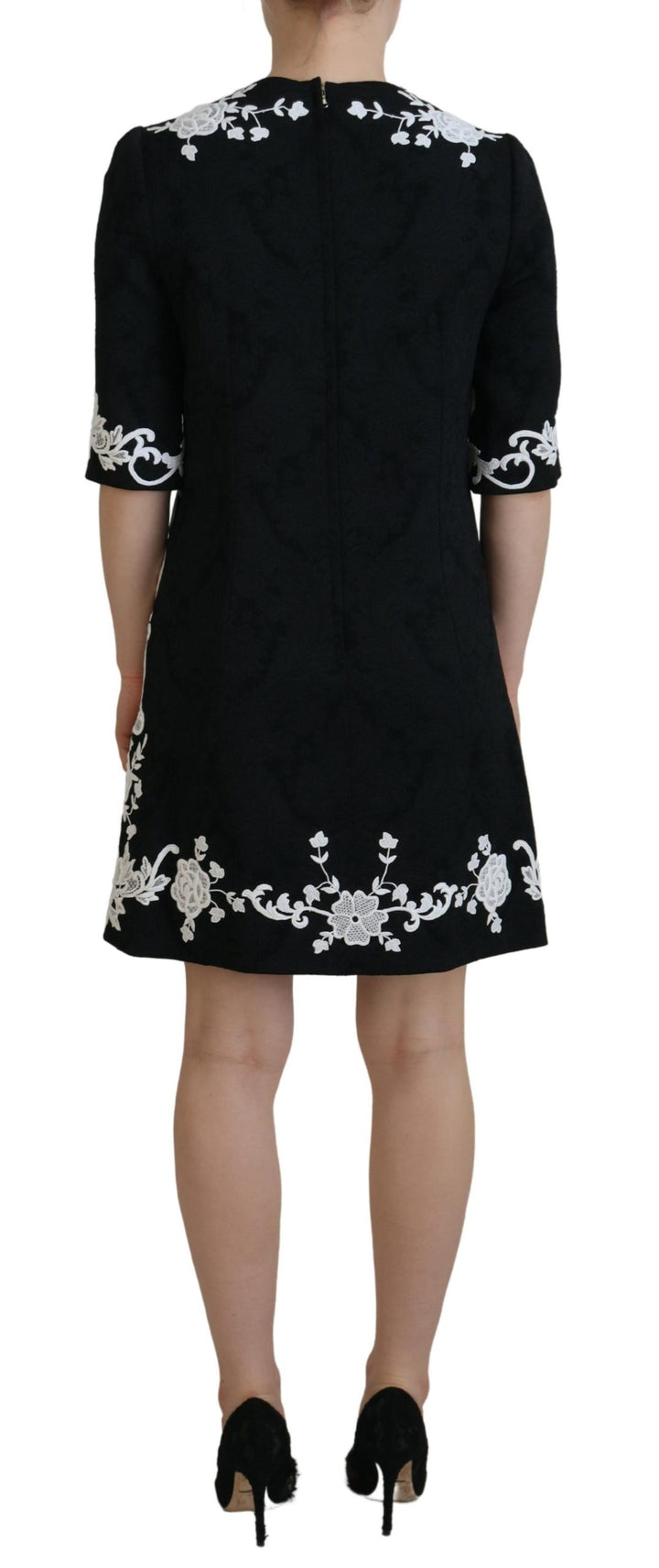 Elegant black A-line mini dress with lace trim