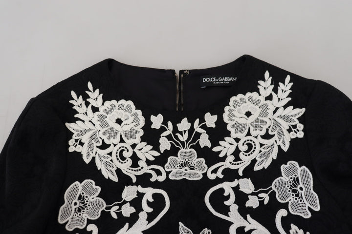 Elegant black A-line mini dress with lace trim
