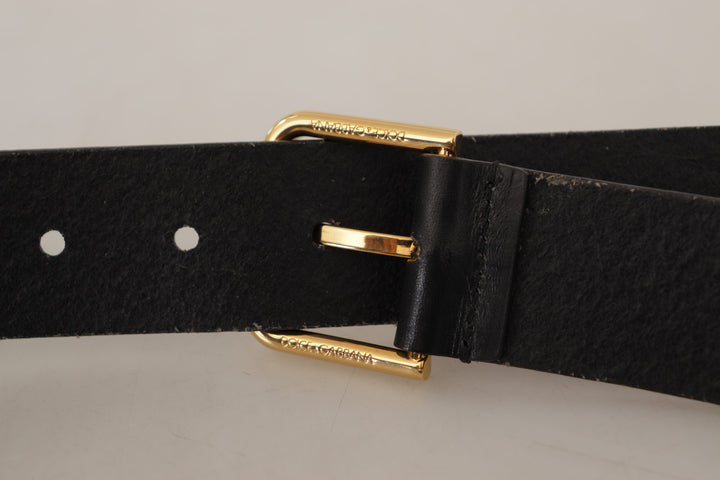Elegant black leather belt with gold-colored buckle