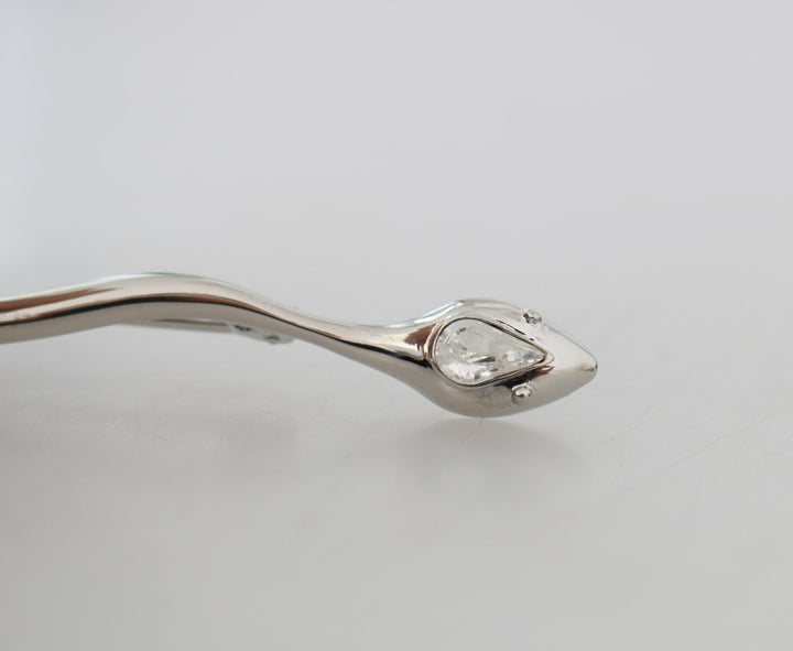 Elegant crystal-embellished brooch made of silver
