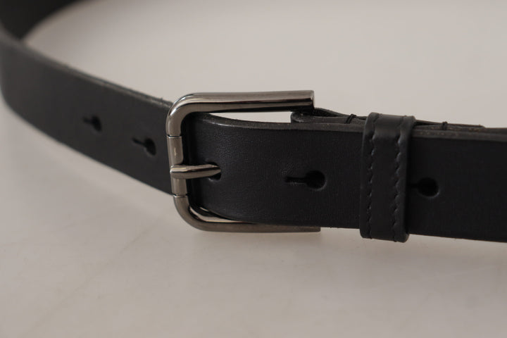 Elegant black leather belt with metal buckle