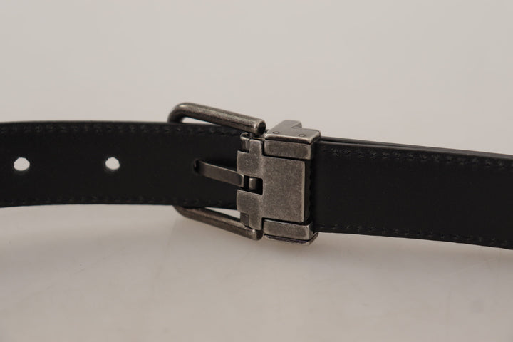 Elegant black leather belt with metal buckle