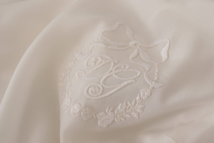 Elegant silk top with logo embroidery