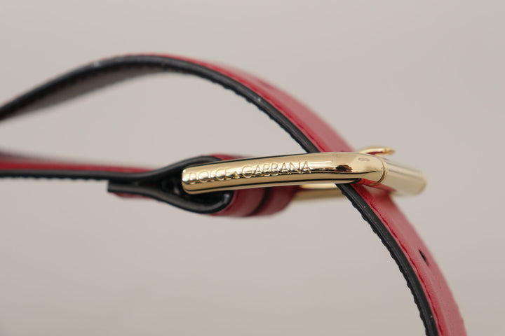 Elegant red leather belt with gold-colored buckle