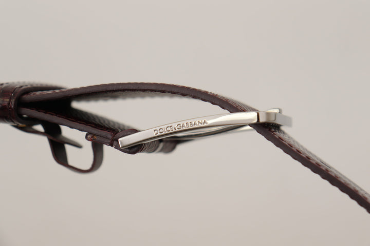 Elegant chestnut brown leather belt with engraved buckle