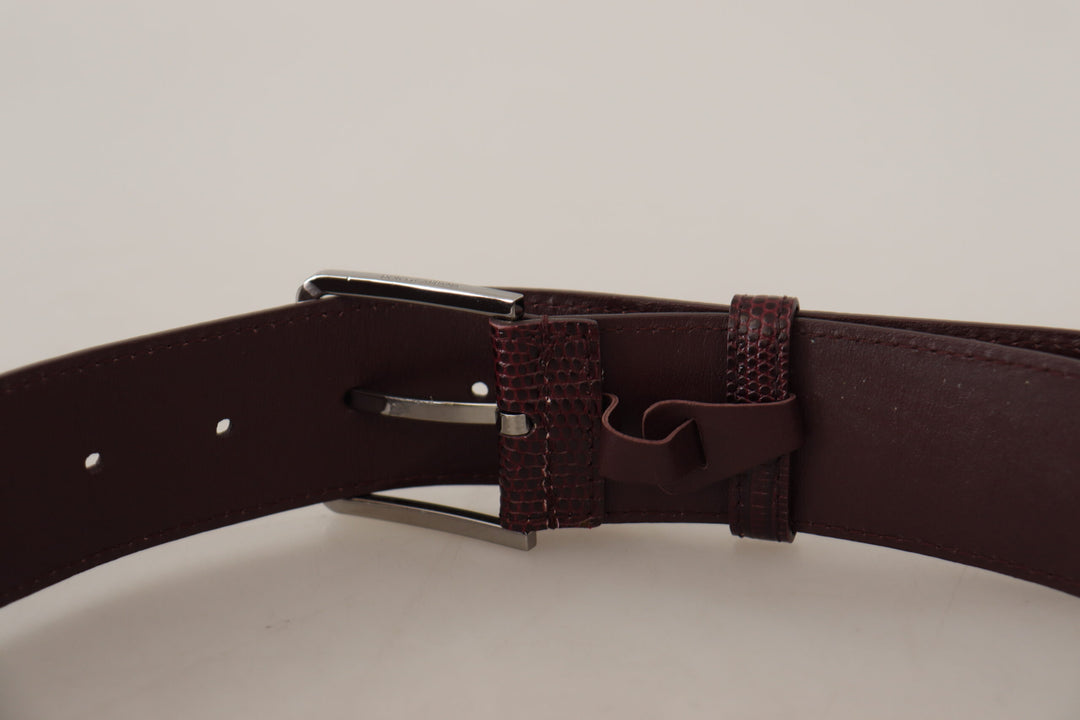 Elegant chestnut brown leather belt with engraved buckle