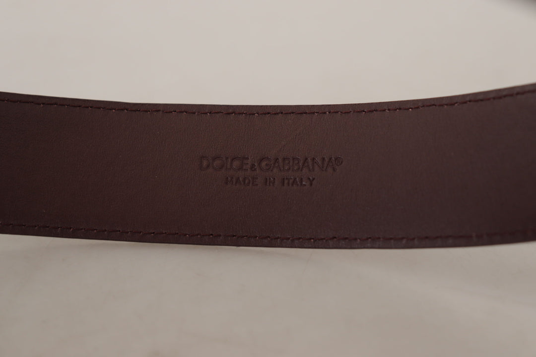 Elegant chestnut brown leather belt with engraved buckle