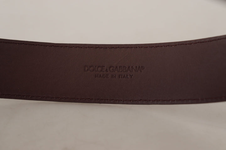 Elegant chestnut brown leather belt with engraved buckle