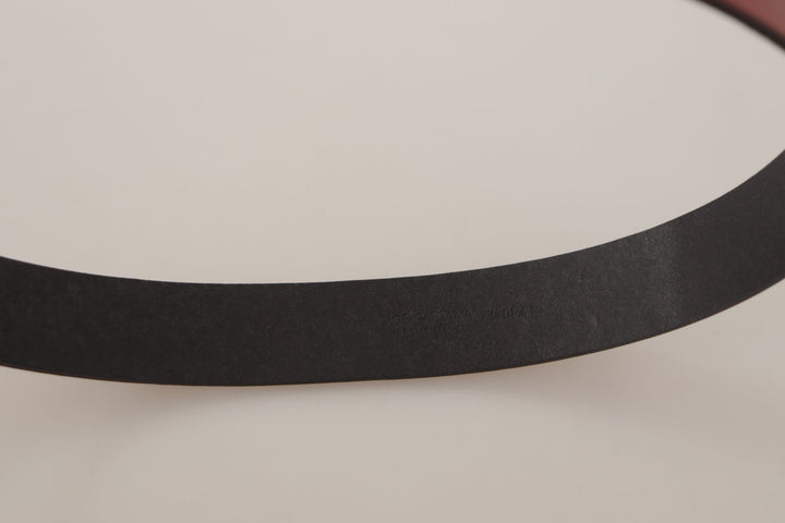 Elegant red leather belt with engraved buckle