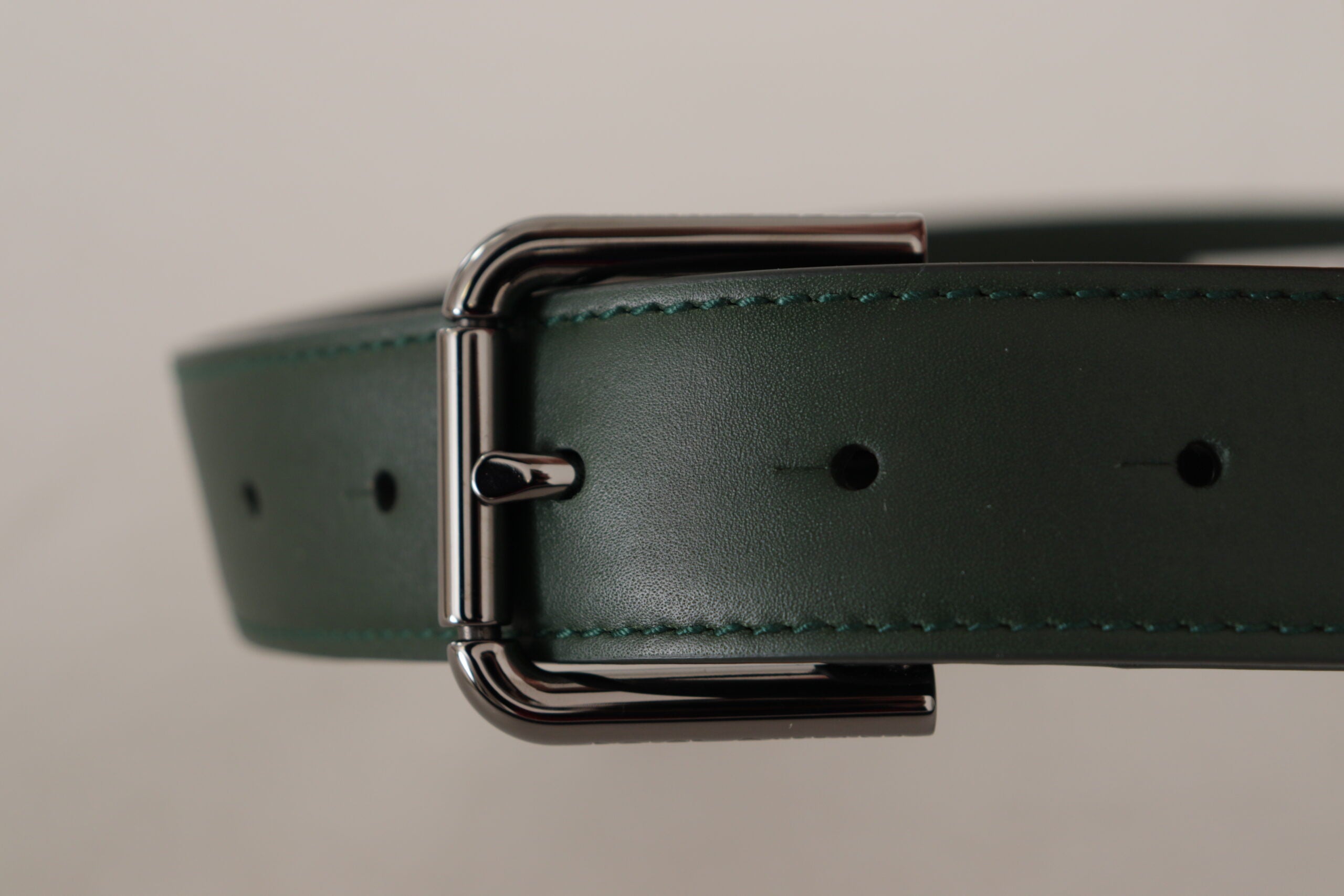 Elegant dark green leather belt with logo buckle