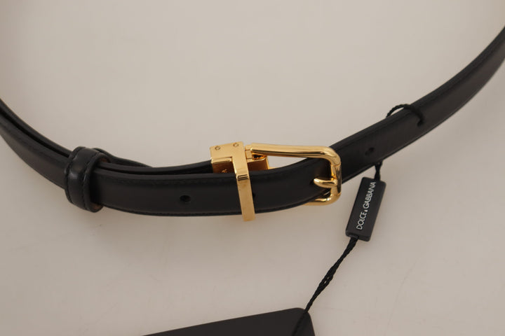 Elegant black leather belt with engraved buckle