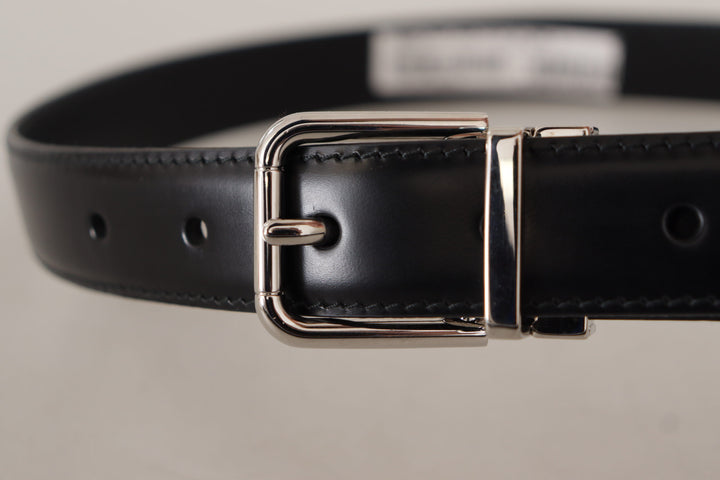 Smooth black leather belt with metal buckle