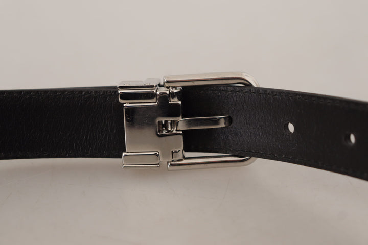 Smooth black leather belt with metal buckle