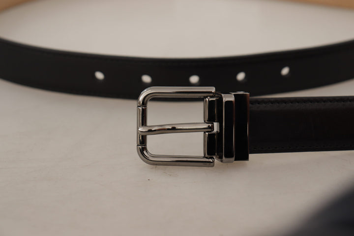 Smooth black leather belt with metal buckle