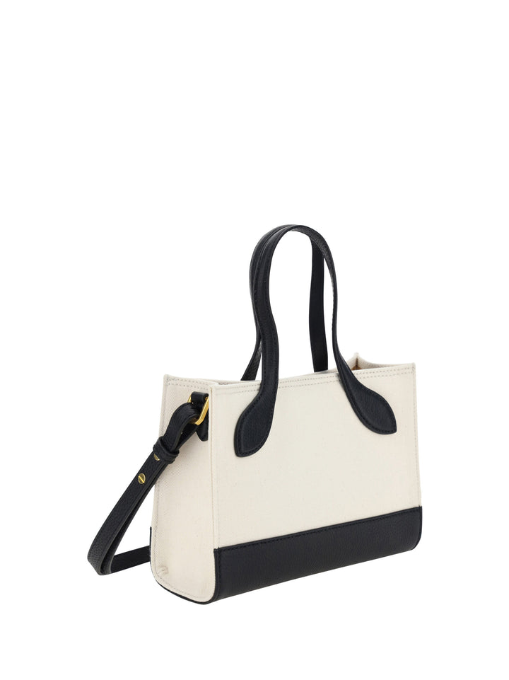Schicke kontrastierende Mini-Lederhandtasche