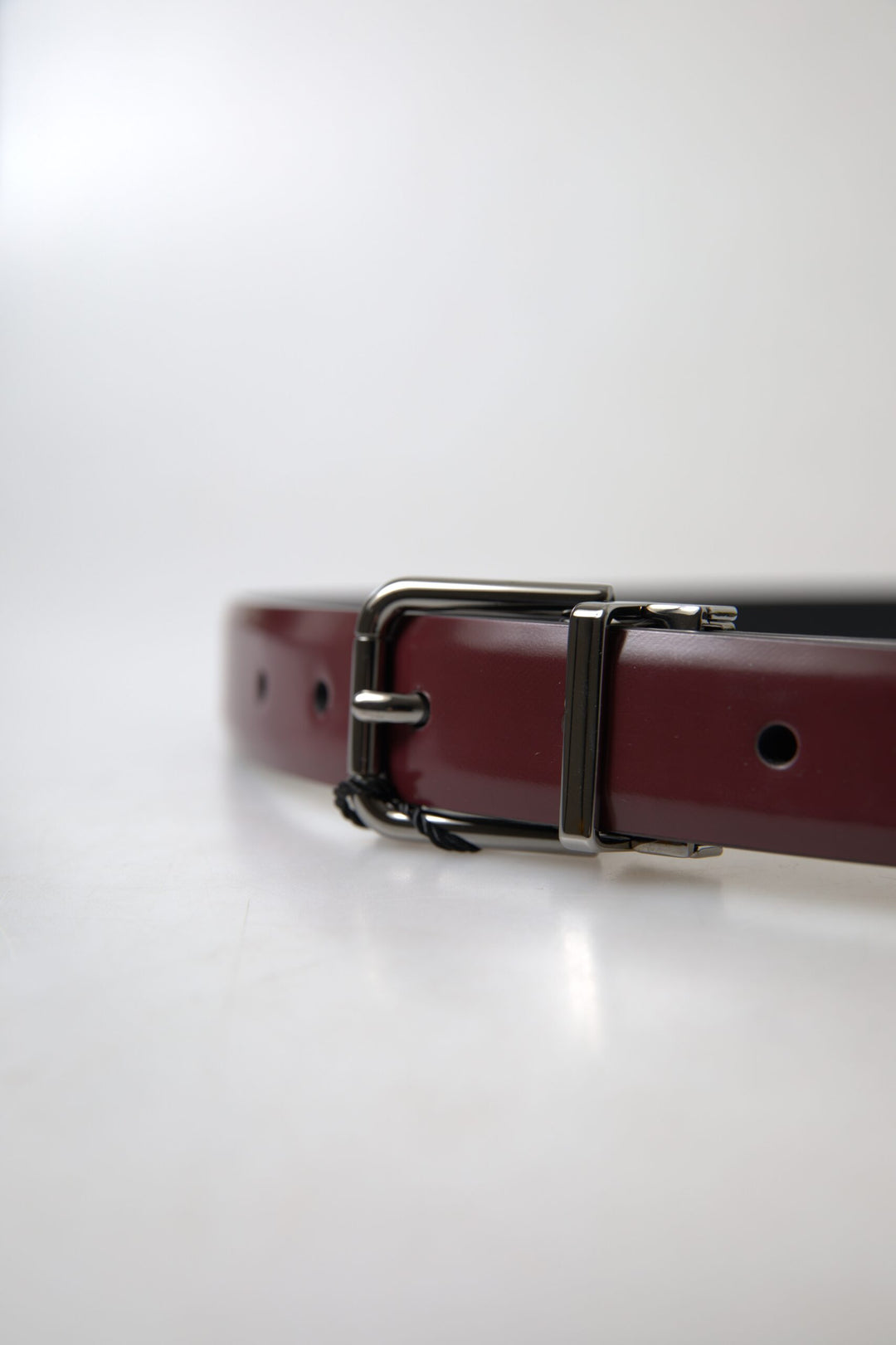 Elegant burgundy leather belt with metal buckle