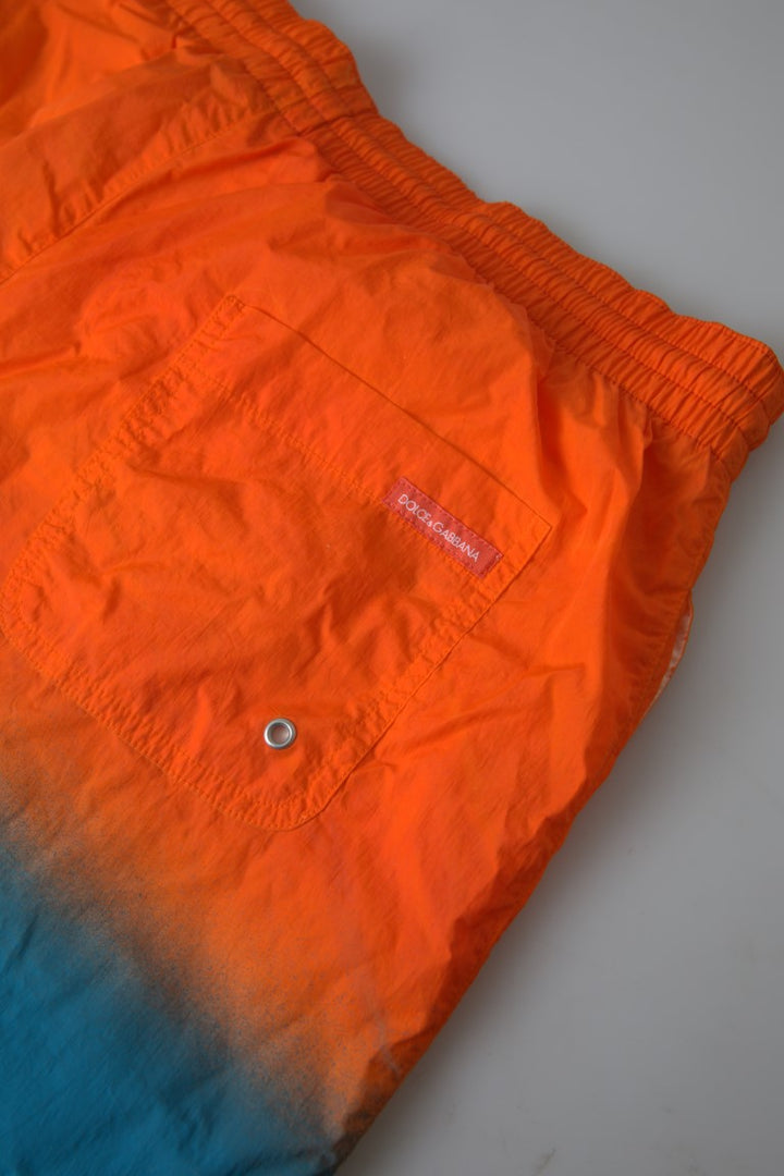 Swim shorts with gradient effect in bright orange