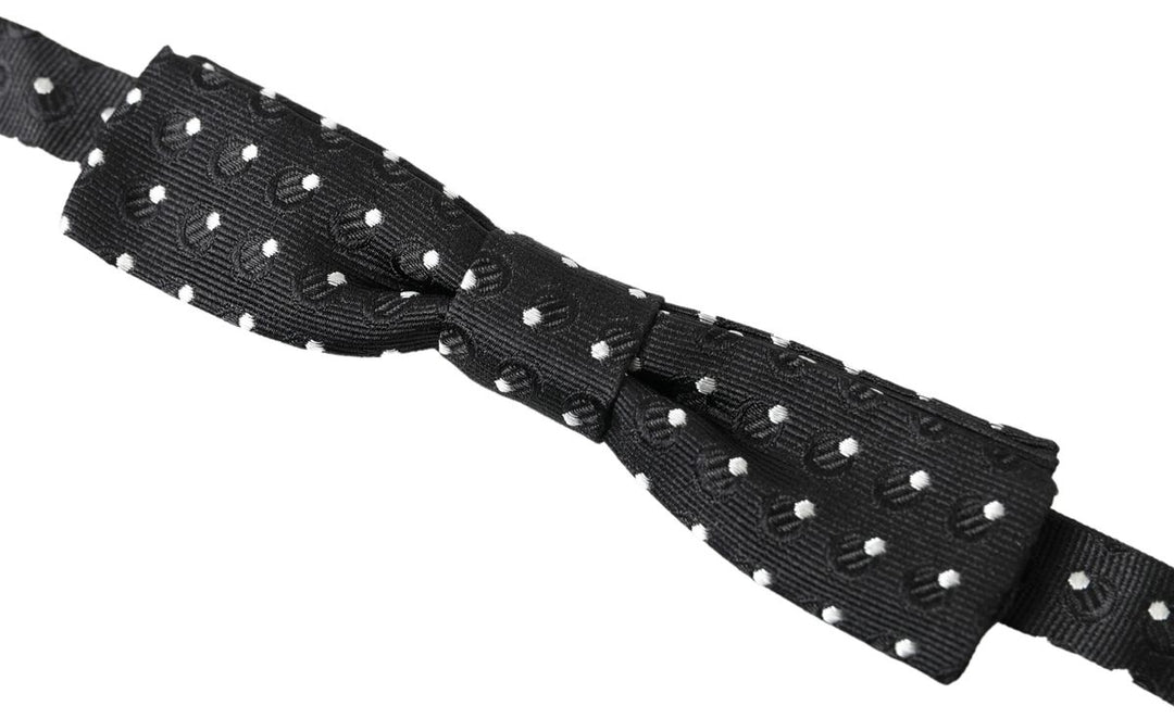 Elegant black silk bow tie with signature clasp