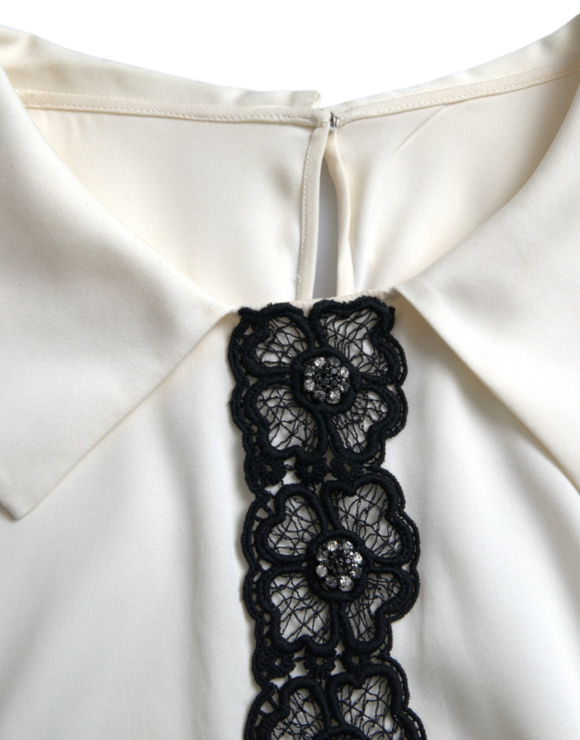 Elegant off-white silk blouse with lace trim