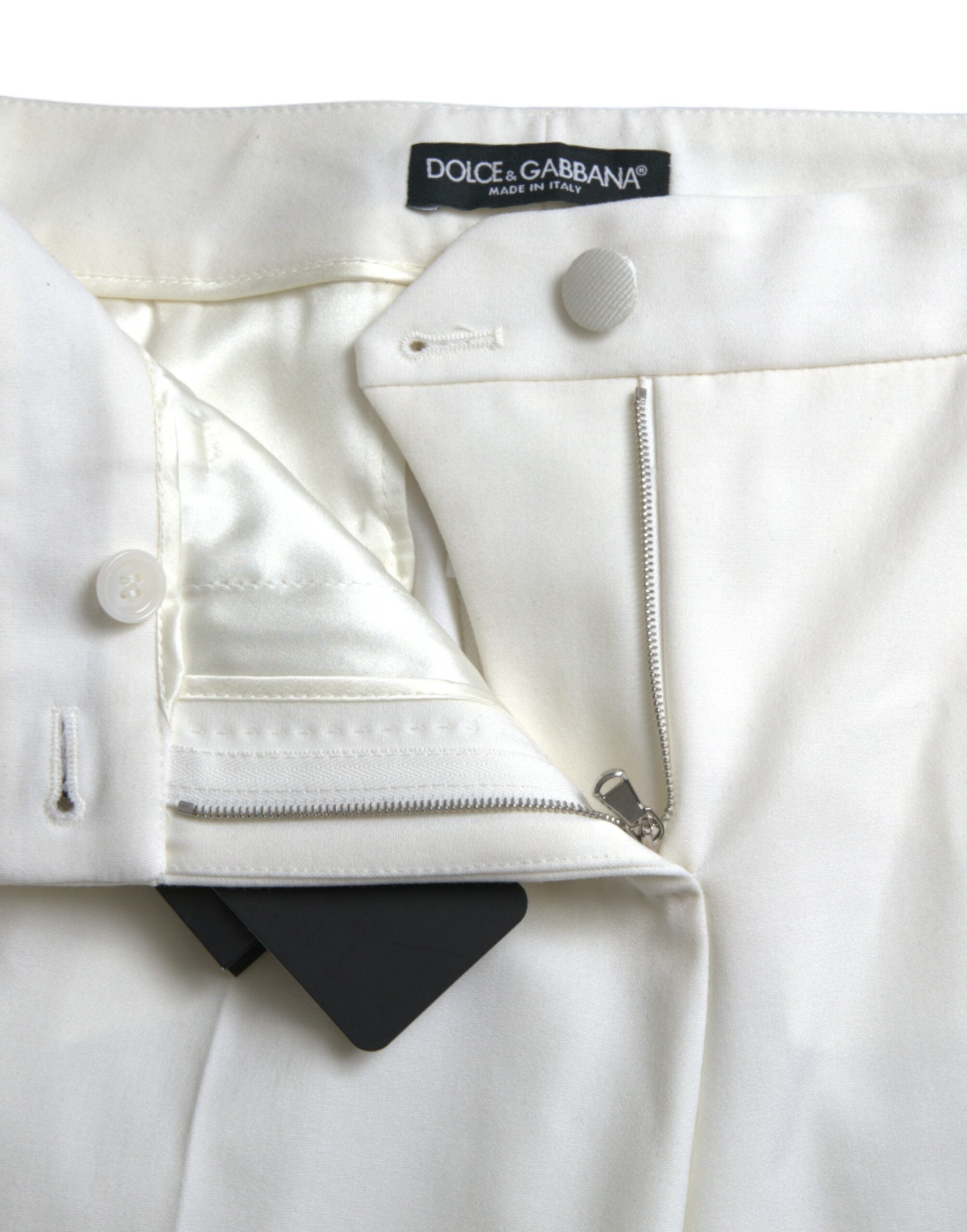 Elegant white tapered trousers with a mid-waist