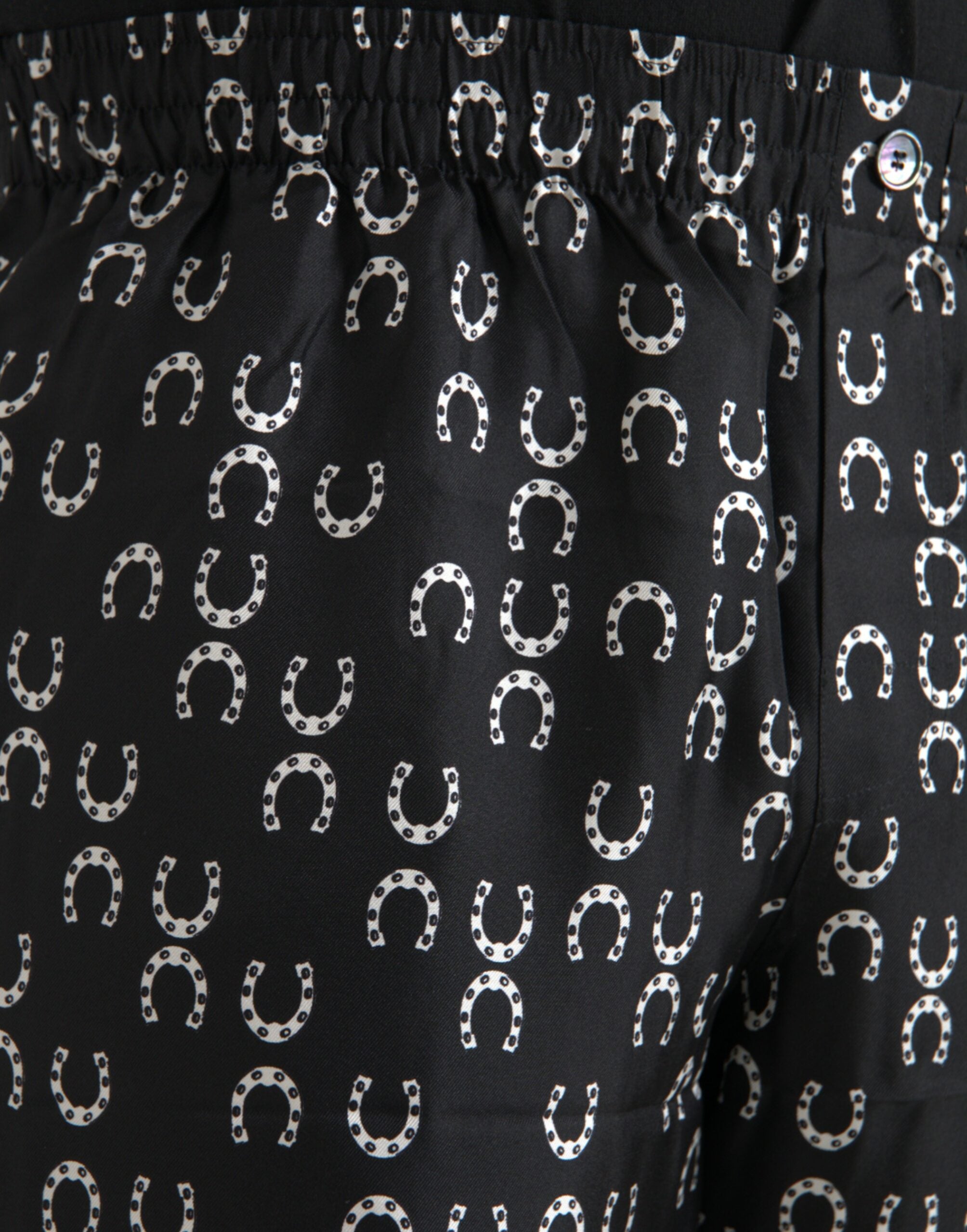 Black silk trousers with horseshoe pattern