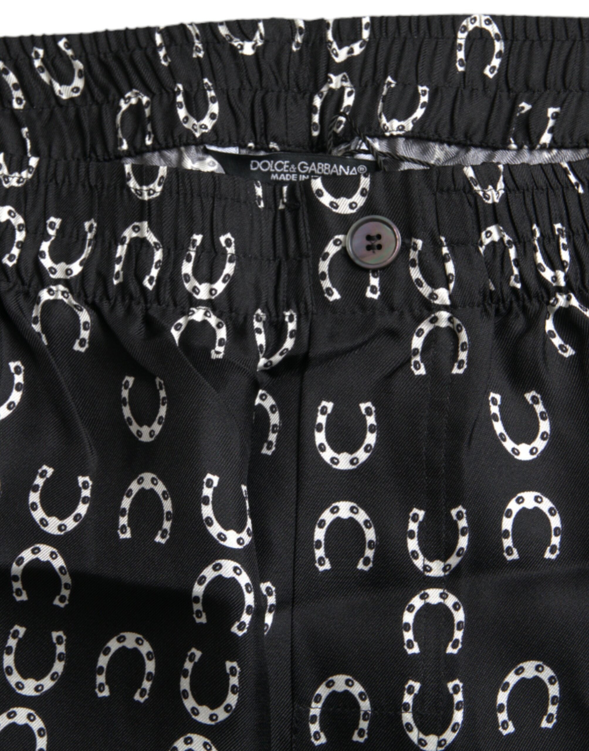 Black silk trousers with horseshoe pattern