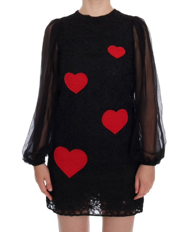 Elegant black shift dress with lace heart appliqué