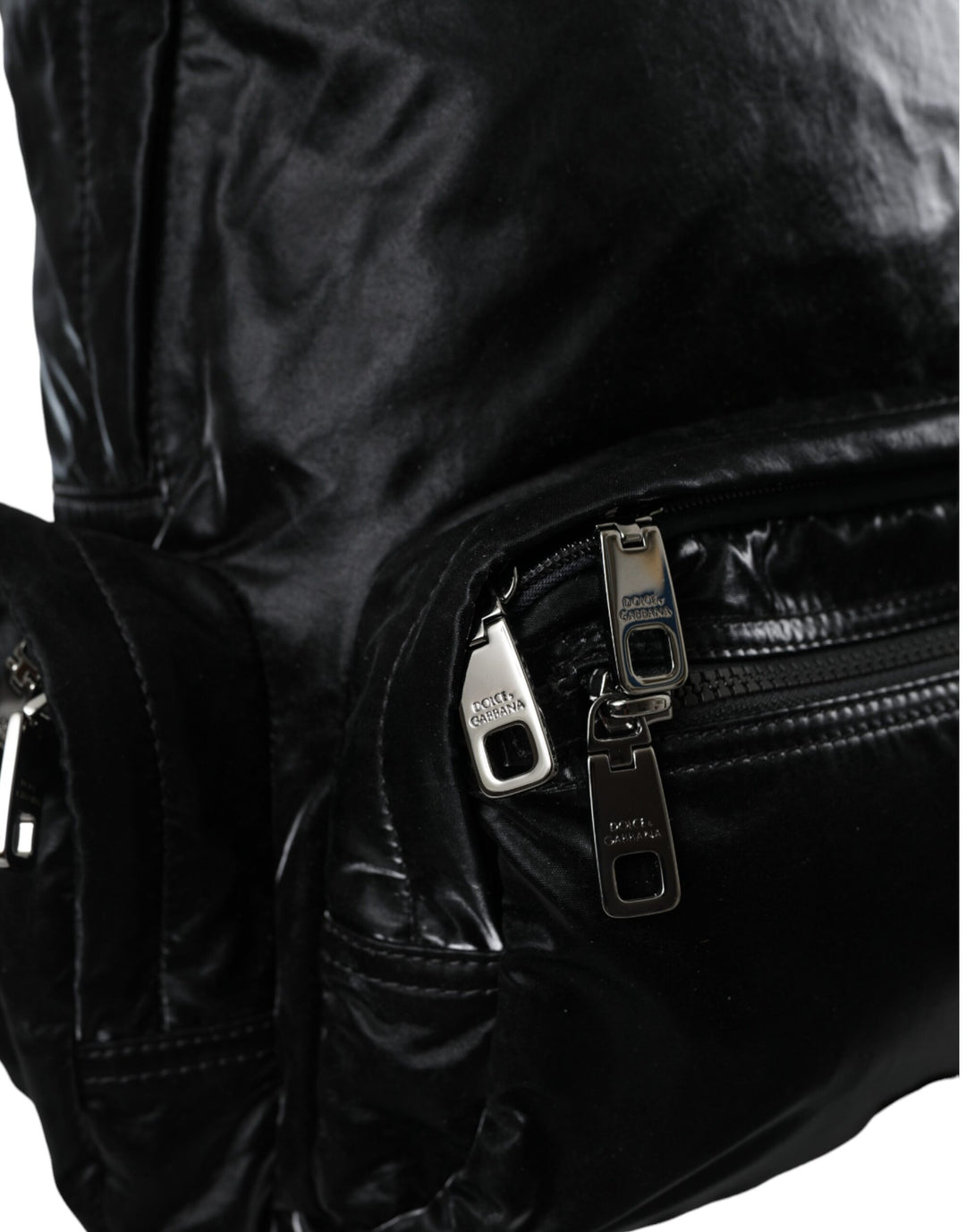 Black patent leather logo plaque backpack bag