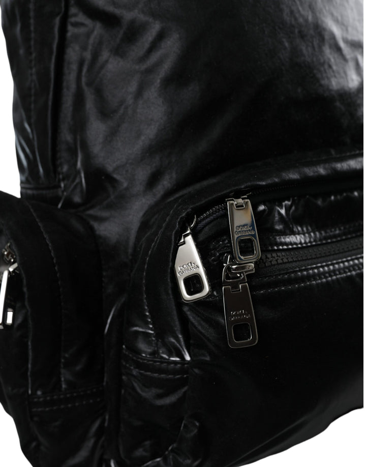 Black patent leather logo plaque backpack bag