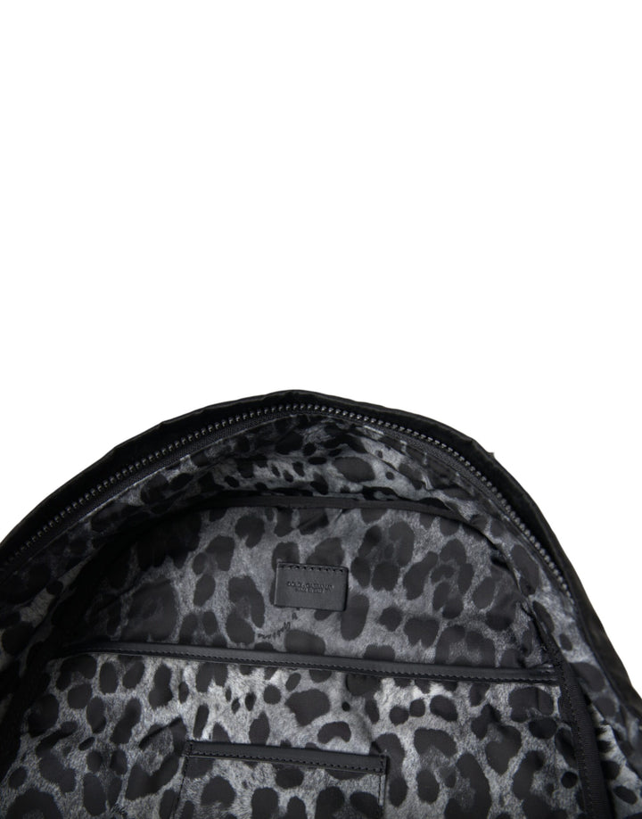 Black patent leather logo plaque backpack bag