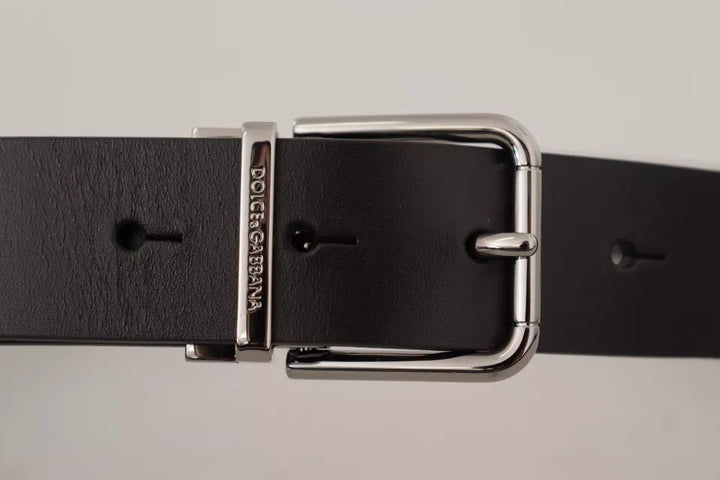 Black calfskin belt with engraved logo and metal buckle
