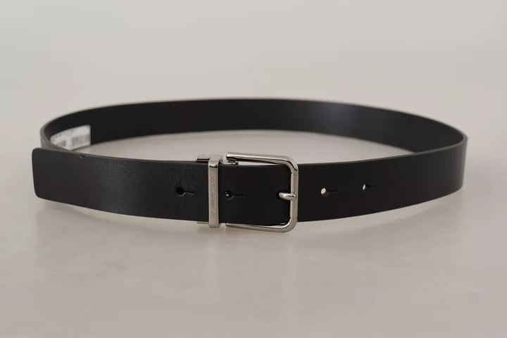 Black calfskin belt with engraved logo and metal buckle