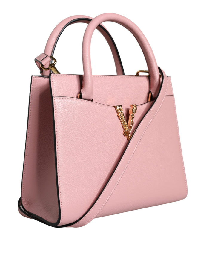 Pink crossbody bag with small handle made of grained calfskin
