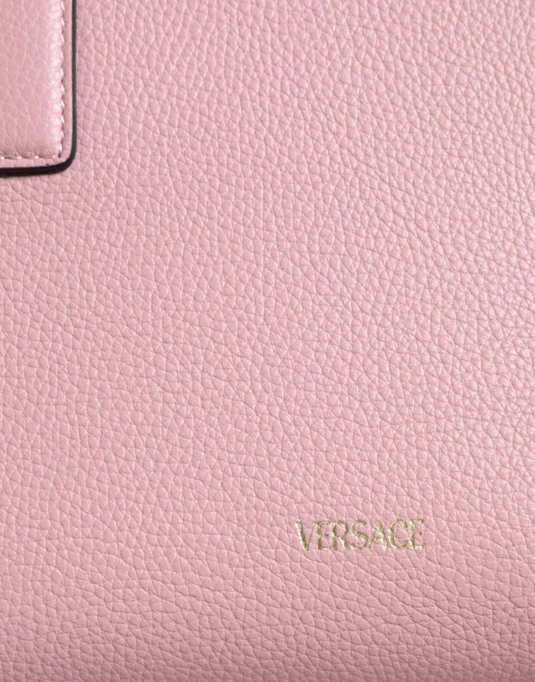 Pink crossbody bag with small handle made of grained calfskin