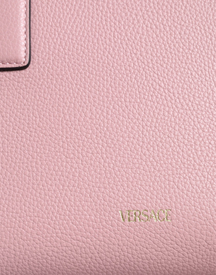 Pink crossbody bag with small handle made of grained calfskin