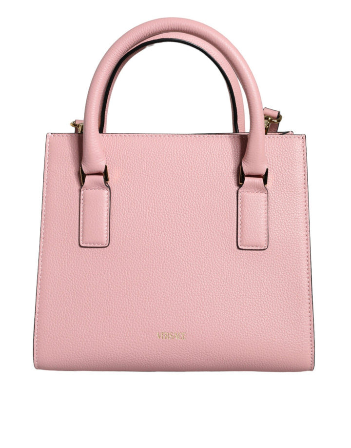 Pink crossbody bag with small handle made of grained calfskin