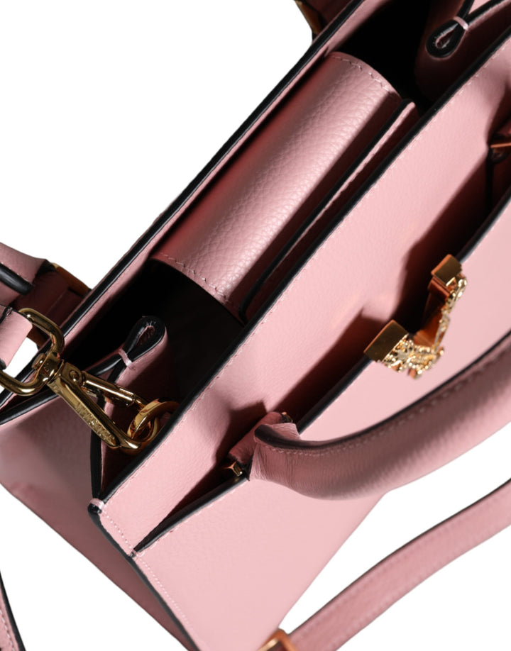 Pink crossbody bag with small handle made of grained calfskin